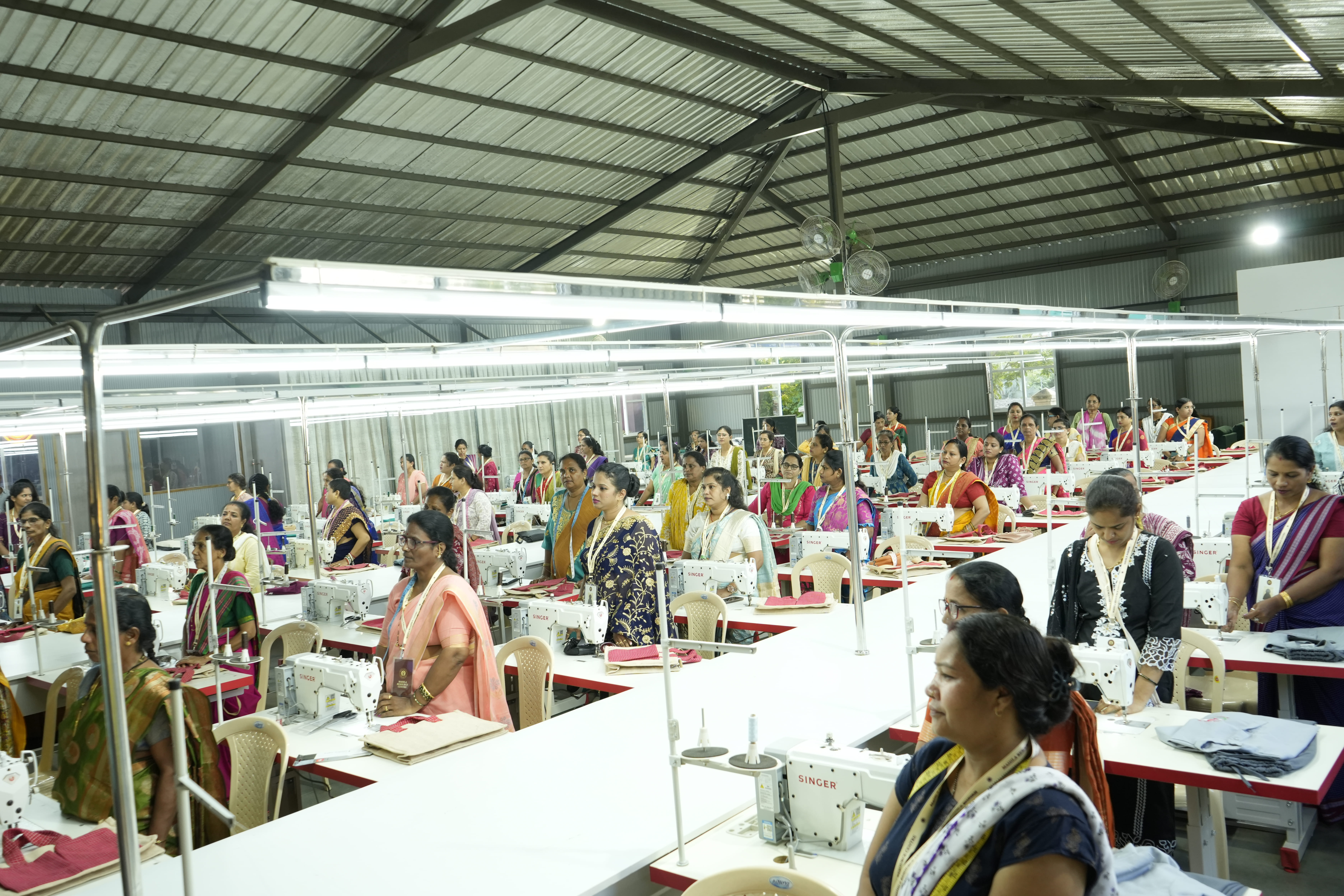 Women learning and working with fabric at Mahila Bhavan
