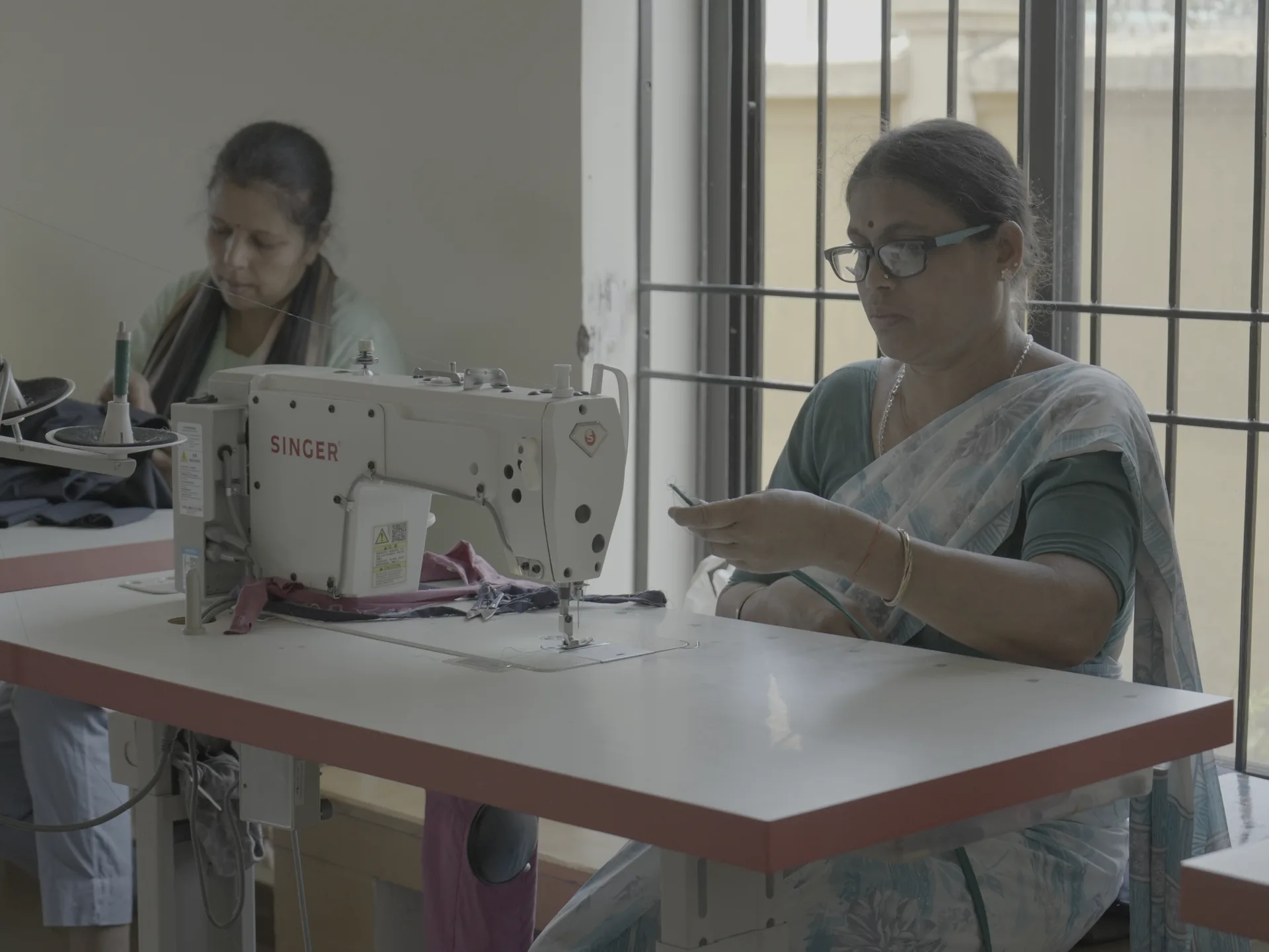 Woman using a sewing machine